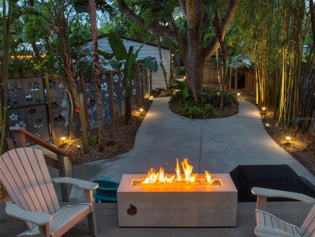536 Faulkner Street New Smyrna Beach, FL 32168 - Photo 36 of 57 a view of a patio with couches table and chairs and potted plants