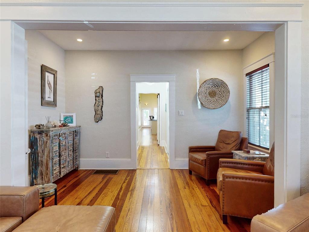 536 Faulkner Street New Smyrna Beach, FL 32168 - Photo 4 of 57 a living room with furniture and a flat screen tv