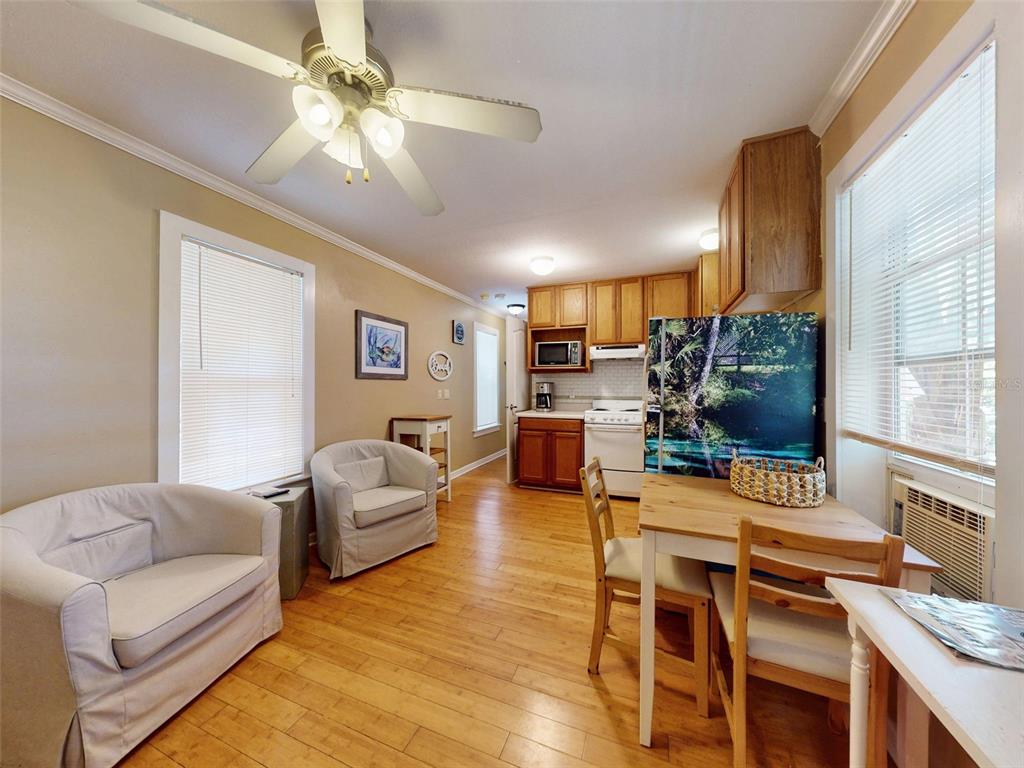536 Faulkner Street New Smyrna Beach, FL 32168 - Photo 44 of 57 a living room with furniture and a flat screen tv