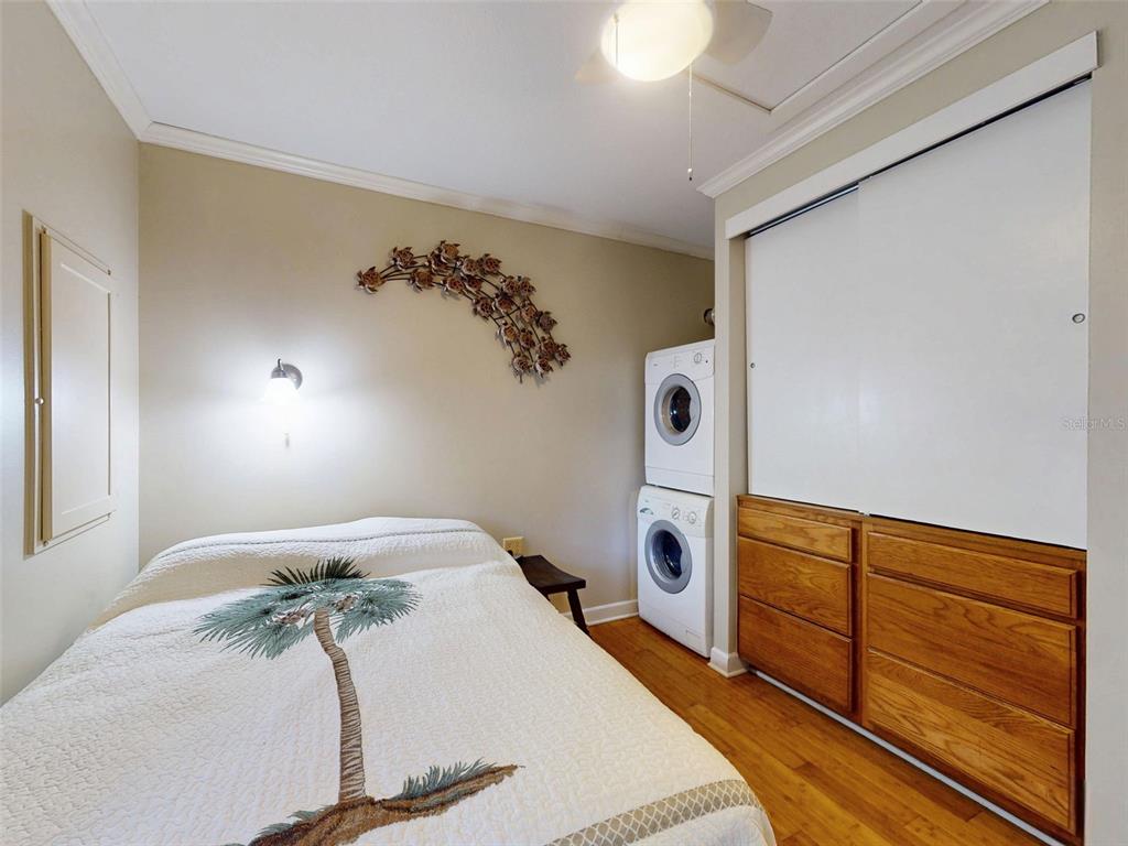 536 Faulkner Street New Smyrna Beach, FL 32168 - Photo 46 of 57 a bedroom with bed and wooden floor