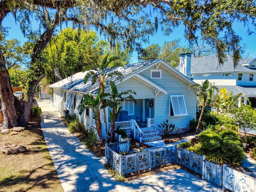 536 Faulkner Street New Smyrna Beach, FL 32168 - Photo 47 of 57 a front view of a house with garden