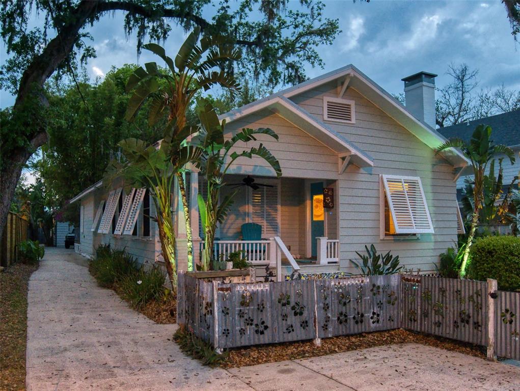536 Faulkner Street New Smyrna Beach, FL 32168 - Photo 57 of 57 a front view of house with a garden