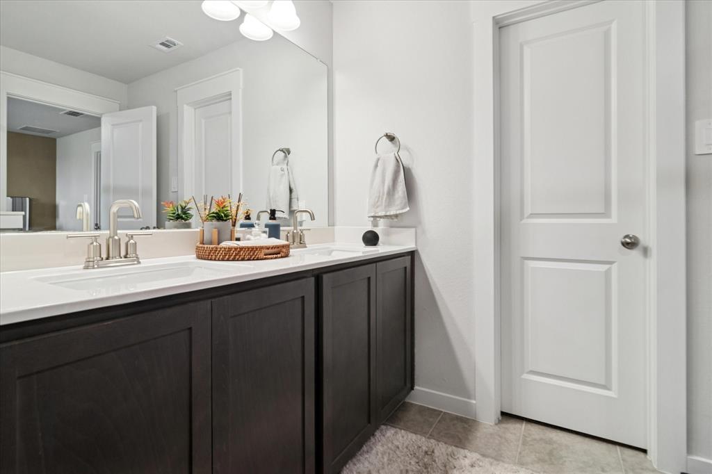3047 Tenor Way Sachse, TX 75048 - Photo 12 of 17 a bathroom with 2 sink and a mirror