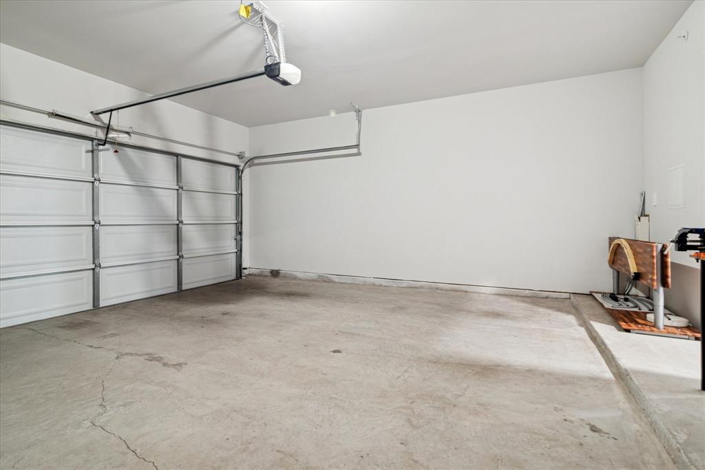 3047 Tenor Way Sachse, TX 75048 - Photo 17 of 17 a view of a room with racks on the wall