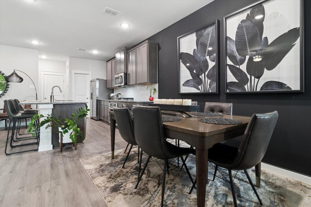 3047 Tenor Way Sachse, TX 75048 - Photo 3 of 17 a view of a dining room with furniture