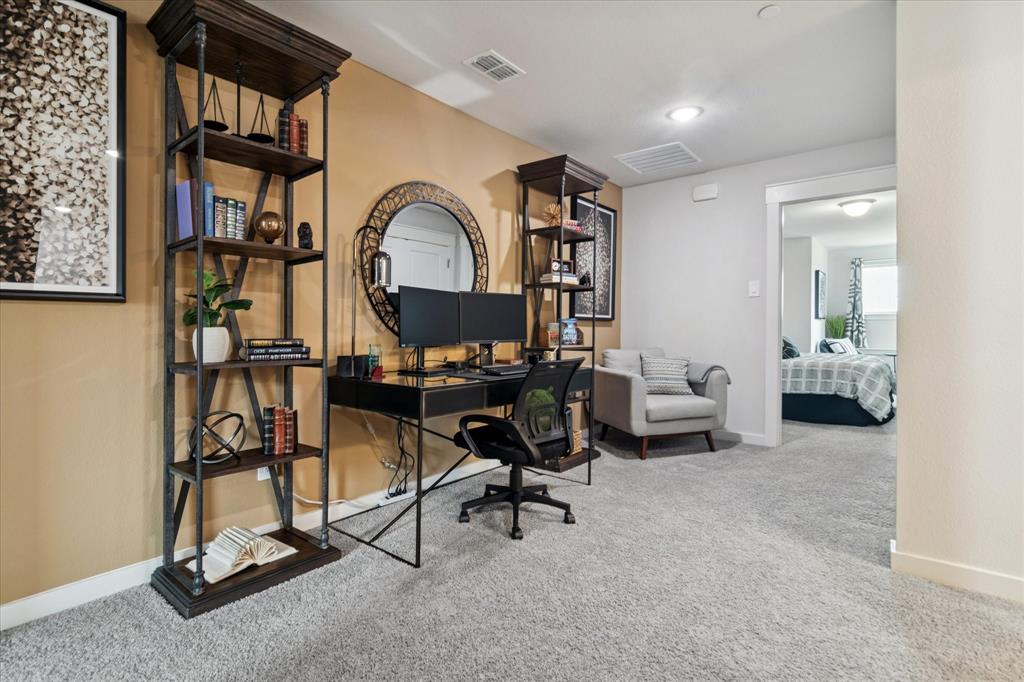 3047 Tenor Way Sachse, TX 75048 - Photo 8 of 17 a view of a livingroom with furniture and a gym equipment