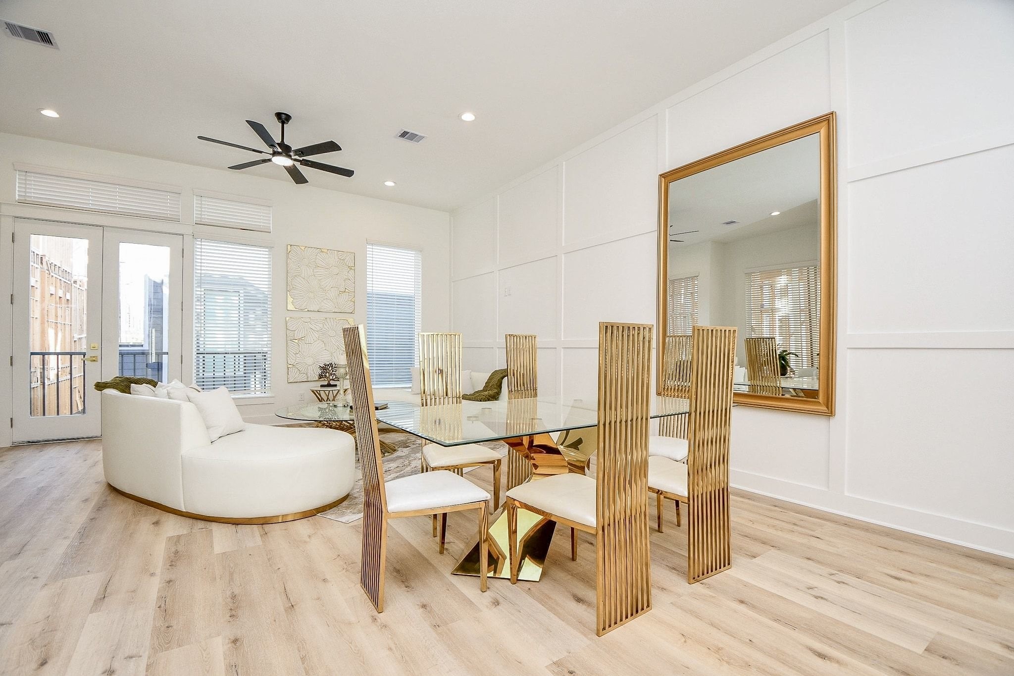 5611 Val Verde Street, Unit A Houston, TX 77057 - Photo 13 of 31 a living room with couches and kitchen view with wooden floor