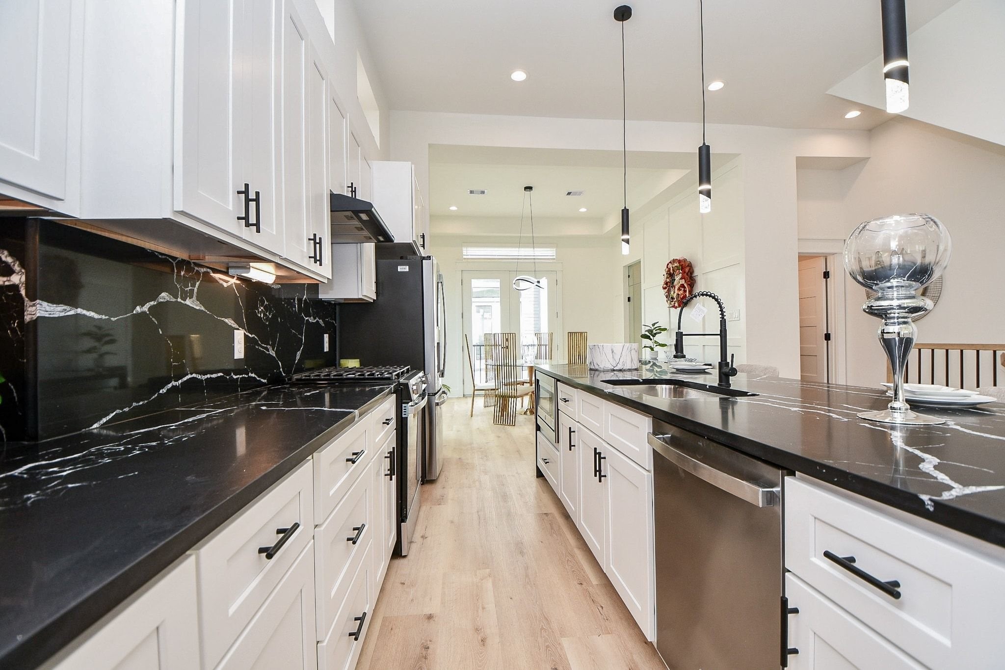 5611 Val Verde Street, Unit A Houston, TX 77057 - Photo 25 of 31 a kitchen with a sink stove and cabinets