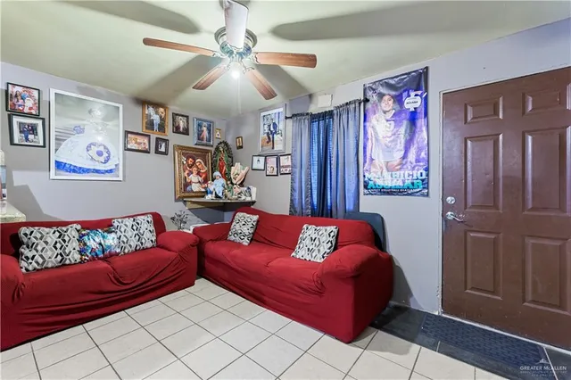 a living room with furniture and a rug
