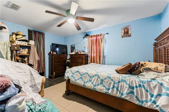 a bedroom with a bed and a dresser