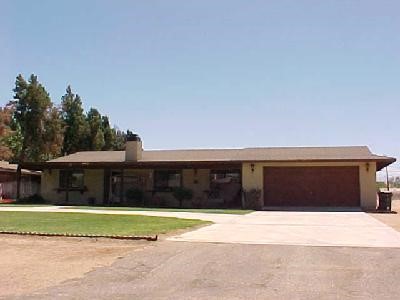 14447 Hopi Road Apple Valley, CA 92307 - Photo 1 of 1 a front view of a house with a yard