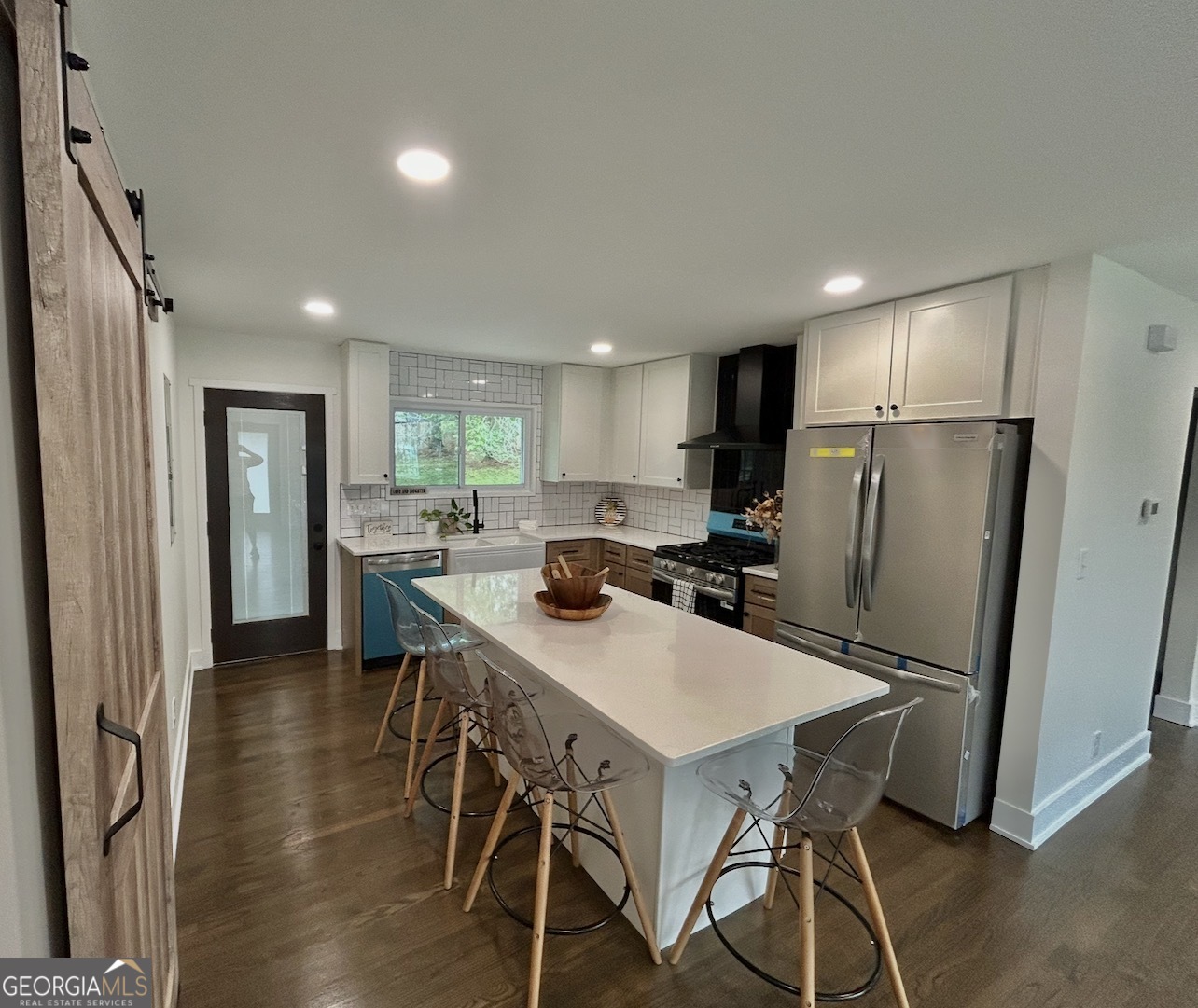 1742 Constitution Road Southeast Atlanta, GA 30316 - Photo 9 of 32 a kitchen with a table chairs refrigerator and microwave