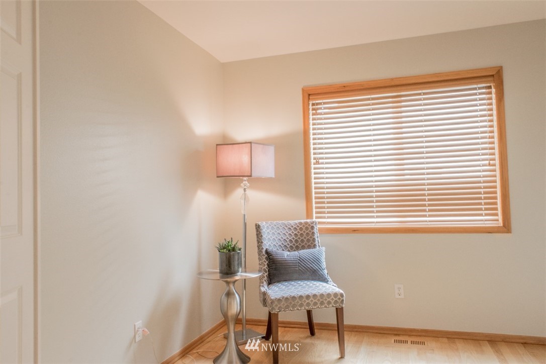 302 172nd Place Southeast Bothell, WA 98012 - Photo 9 of 20 a chair and a table in a room