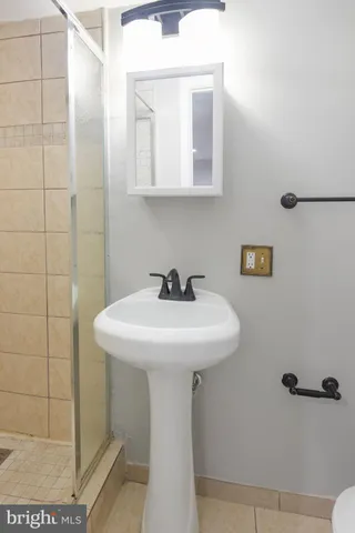 a sink sitting next to a bathroom