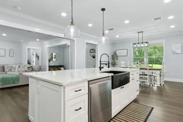 a kitchen with cabinets and window