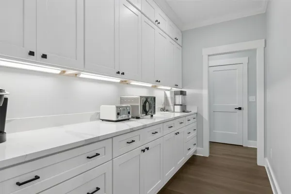 a view of an entryway with wooden floor
