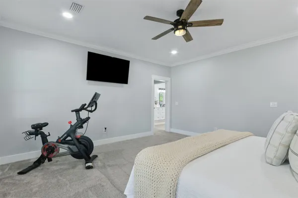 a view of a livingroom with a space & a flat screen tv