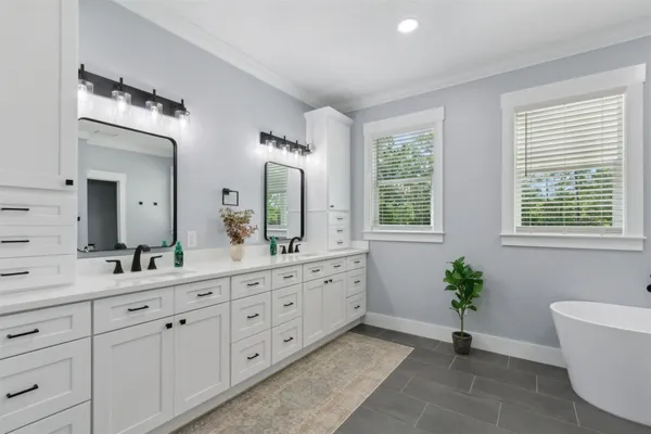 a bedroom with furniture and a window