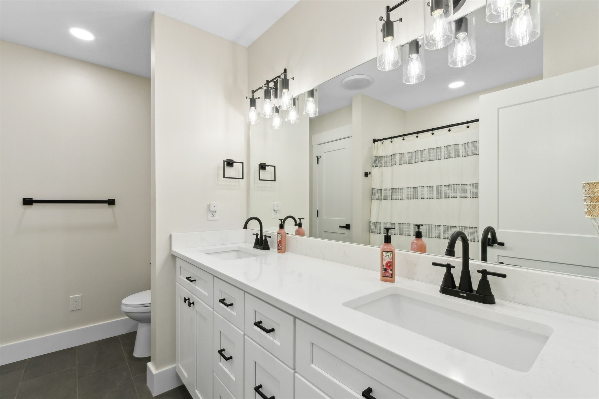 15550 County Road 108 Hilliard, FL 32046 - Photo 44 of 64 a bathroom with a sink a toilet and a mirror