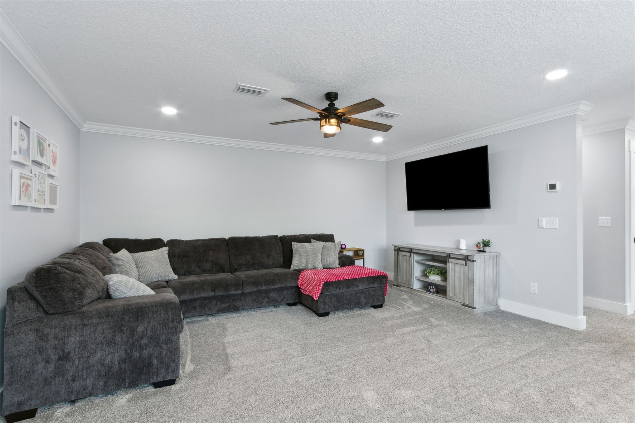 15550 County Road 108 Hilliard, FL 32046 - Photo 49 of 64 a living room with furniture and a flat screen tv