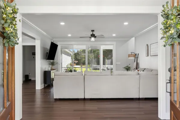 a living room with furniture and a large window
