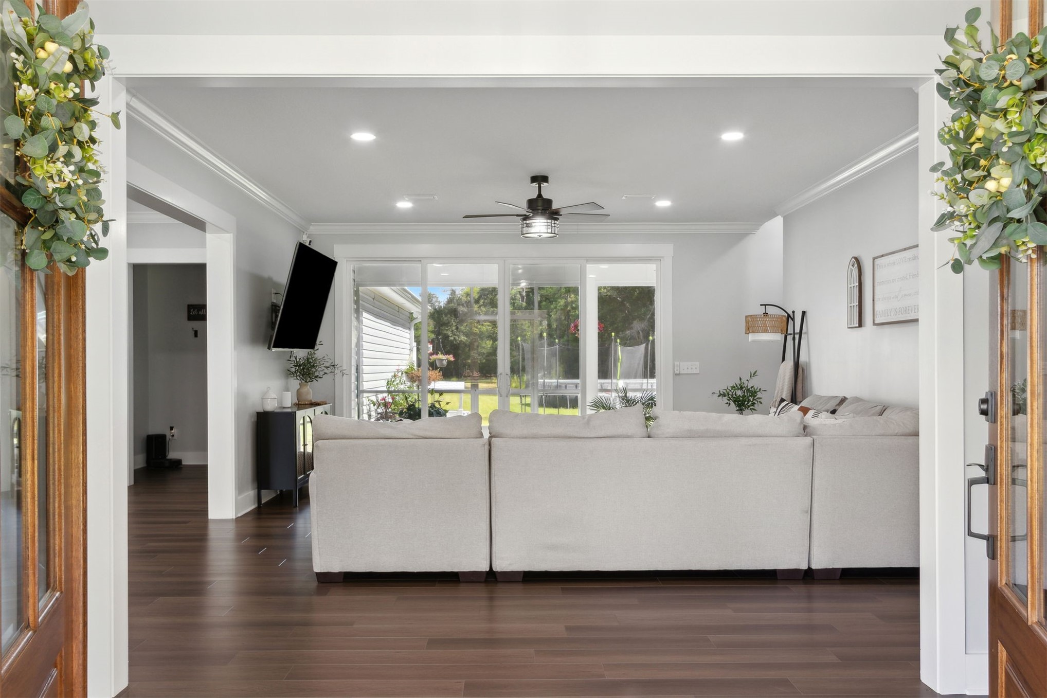 15550 County Road 108 Hilliard, FL 32046 - Photo 10 of 64 a living room with stainless steel appliances furniture wooden floor and a kitchen view