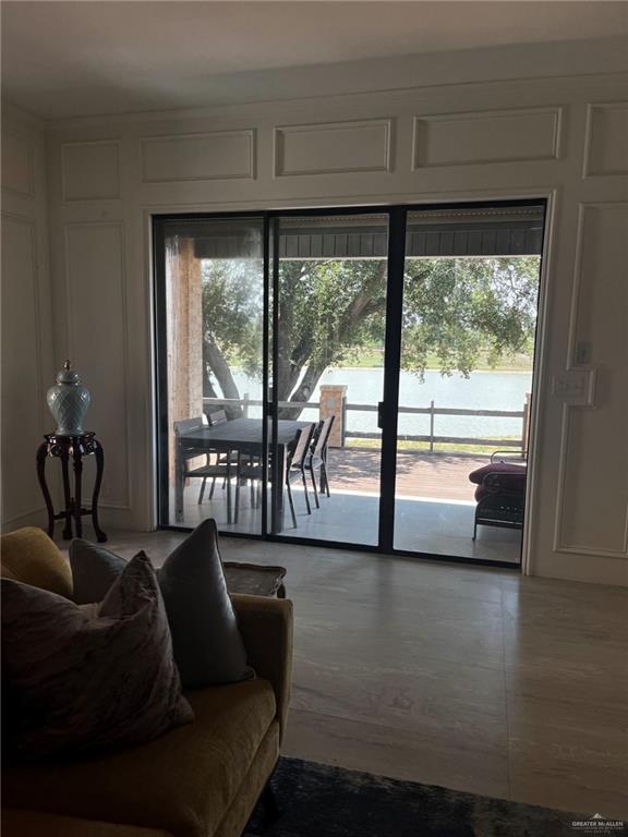 406 Rio Grande Drive Mission, TX 78572 - Photo 11 of 27 Living area featuring a decorative wall and a water view