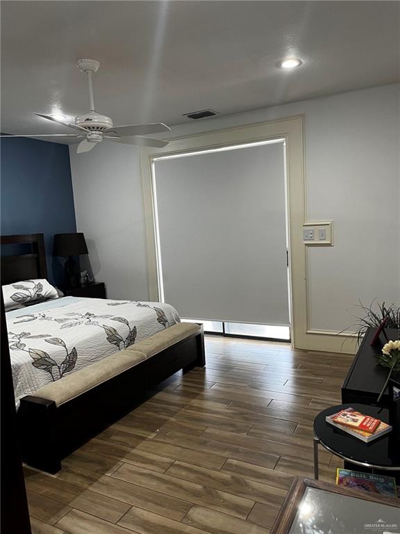 406 Rio Grande Drive Mission, TX 78572 - Photo 12 of 27 Bedroom featuring dark wood-style flooring and a ceiling fan