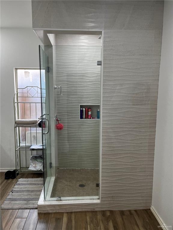 406 Rio Grande Drive Mission, TX 78572 - Photo 15 of 27 Bathroom with dark wood-type flooring and a stall shower