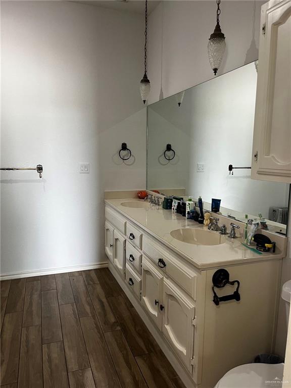 406 Rio Grande Drive Mission, TX 78572 - Photo 19 of 27 Full bath featuring dark wood-style flooring and double vanity