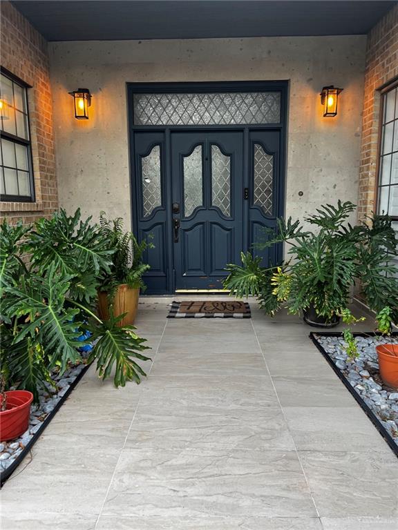 406 Rio Grande Drive Mission, TX 78572 - Photo 2 of 27 Doorway to property with stucco siding