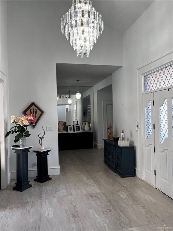 406 Rio Grande Drive Mission, TX 78572 - Photo 4 of 27 Entrance foyer featuring a towering ceiling and a chandelier