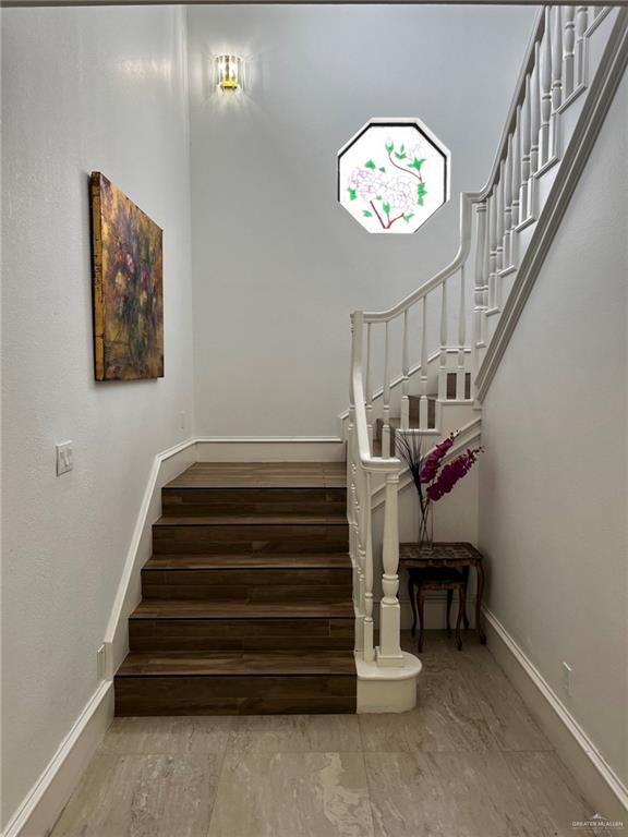 406 Rio Grande Drive Mission, TX 78572 - Photo 6 of 27 Stairs featuring baseboards and wood finished floors