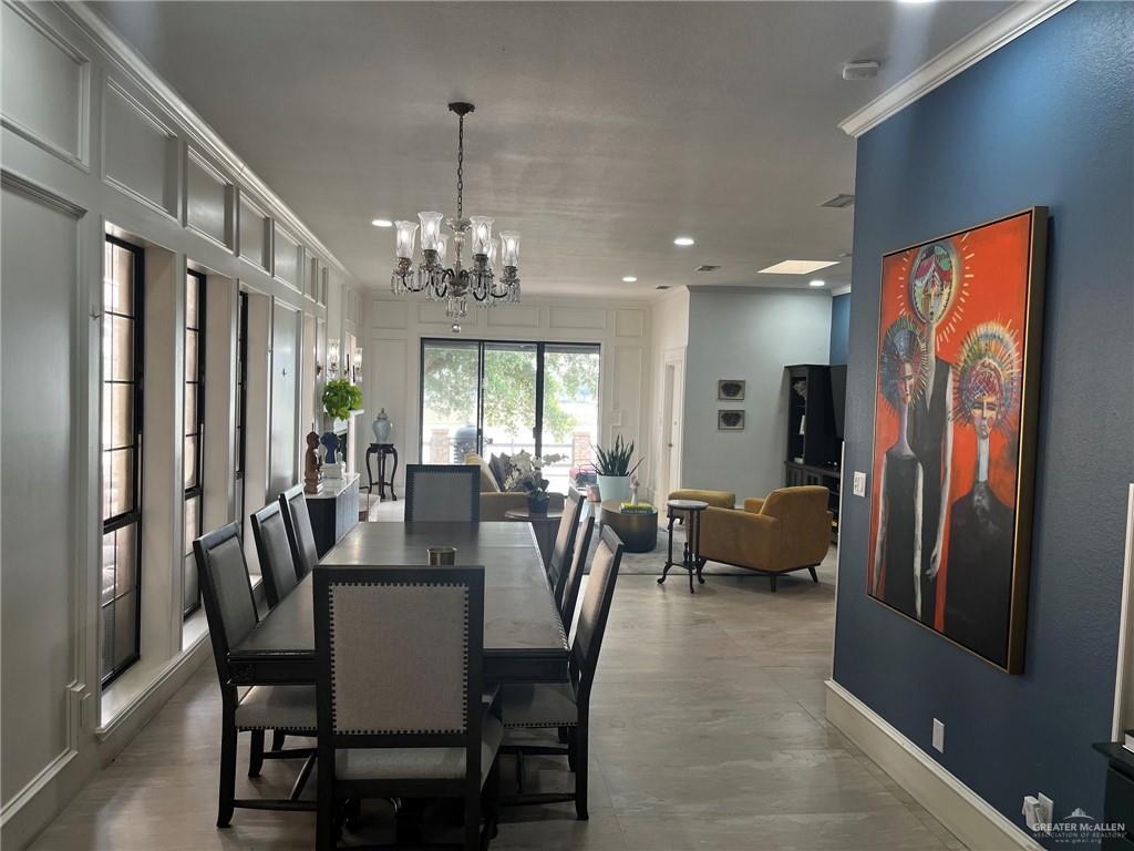 406 Rio Grande Drive Mission, TX 78572 - Photo 9 of 27 Dining room featuring a chandelier, a decorative wall, ornamental molding, and recessed lighting