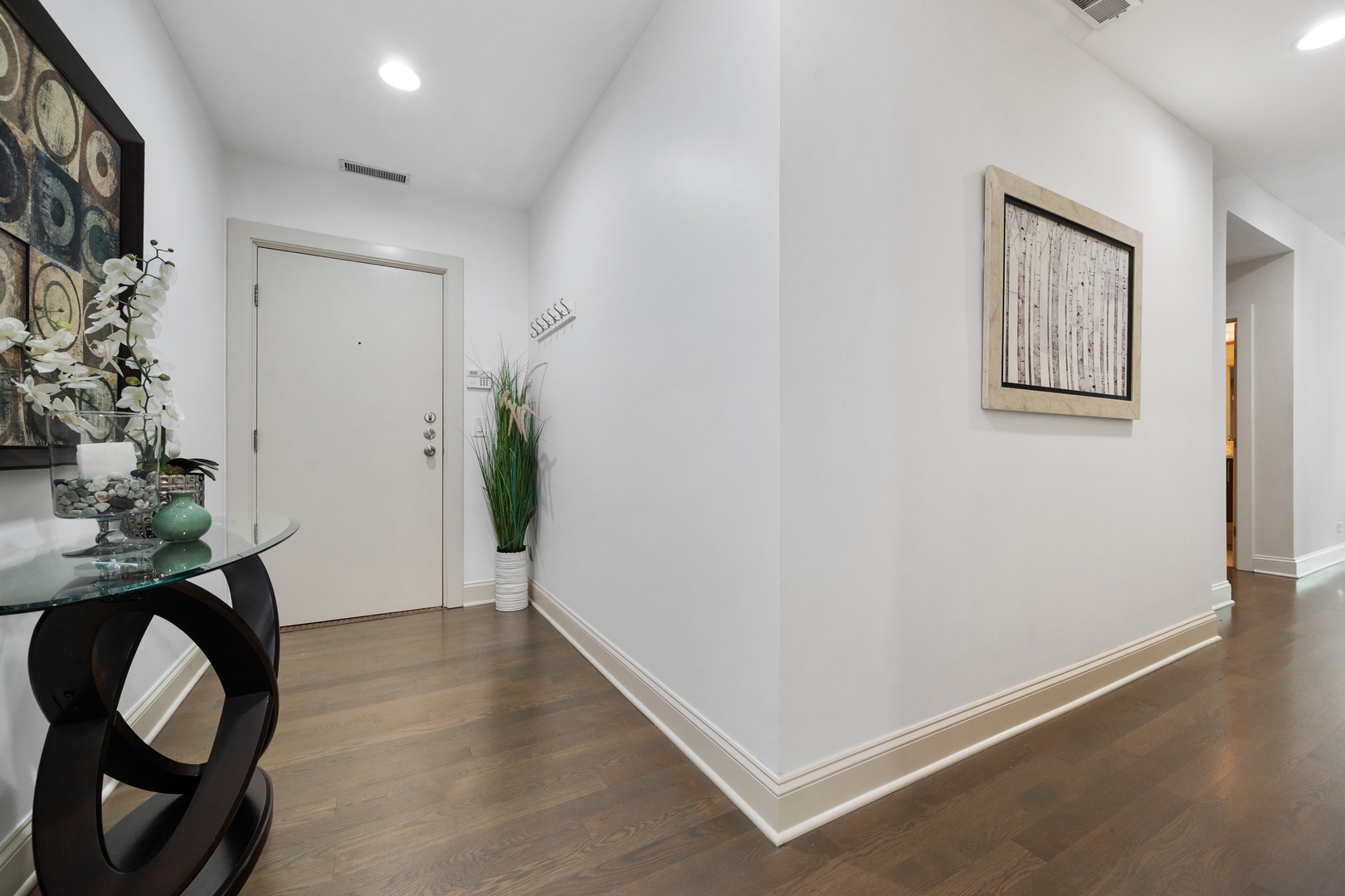 1850 West Division Street, Unit 2E Chicago, IL 60622 - Photo 2 of 22 a view of an entryway with wooden floor