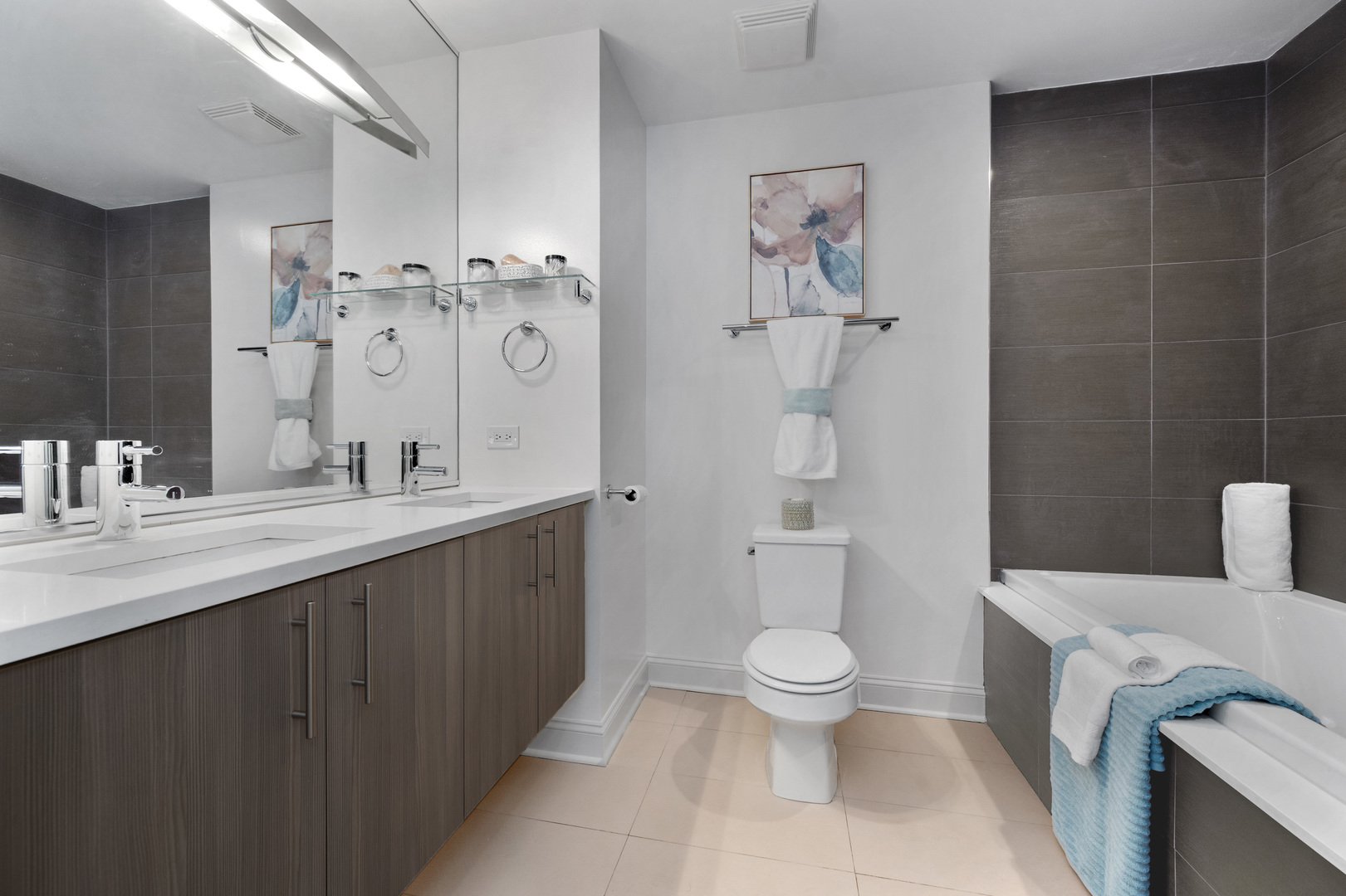 1850 West Division Street, Unit 2E Chicago, IL 60622 - Photo 12 of 22 a spacious bathroom with a double vanity sink a toilet and a shower