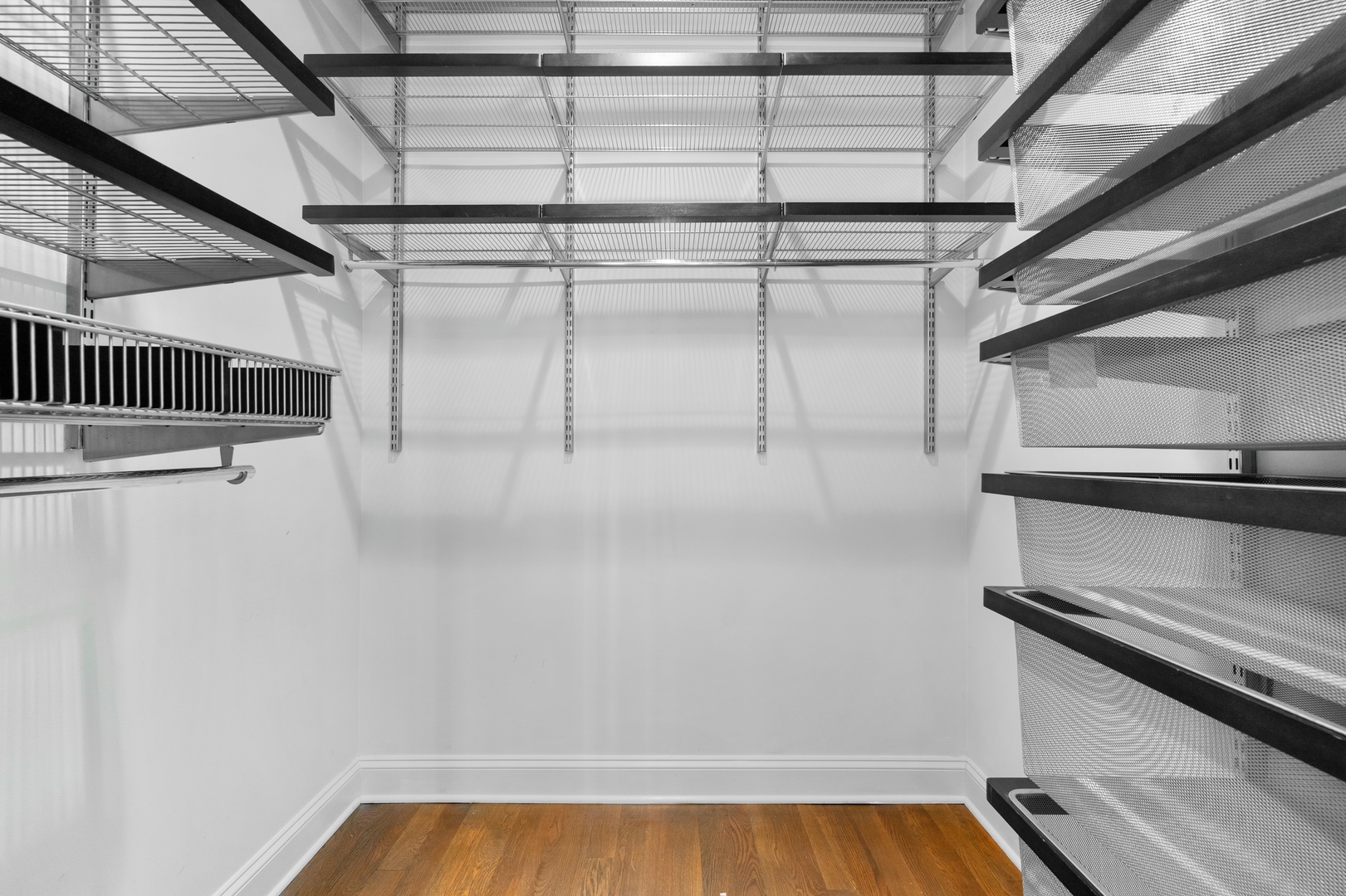 1850 West Division Street, Unit 2E Chicago, IL 60622 - Photo 14 of 22 a view of storage and utility room with racks on the wall