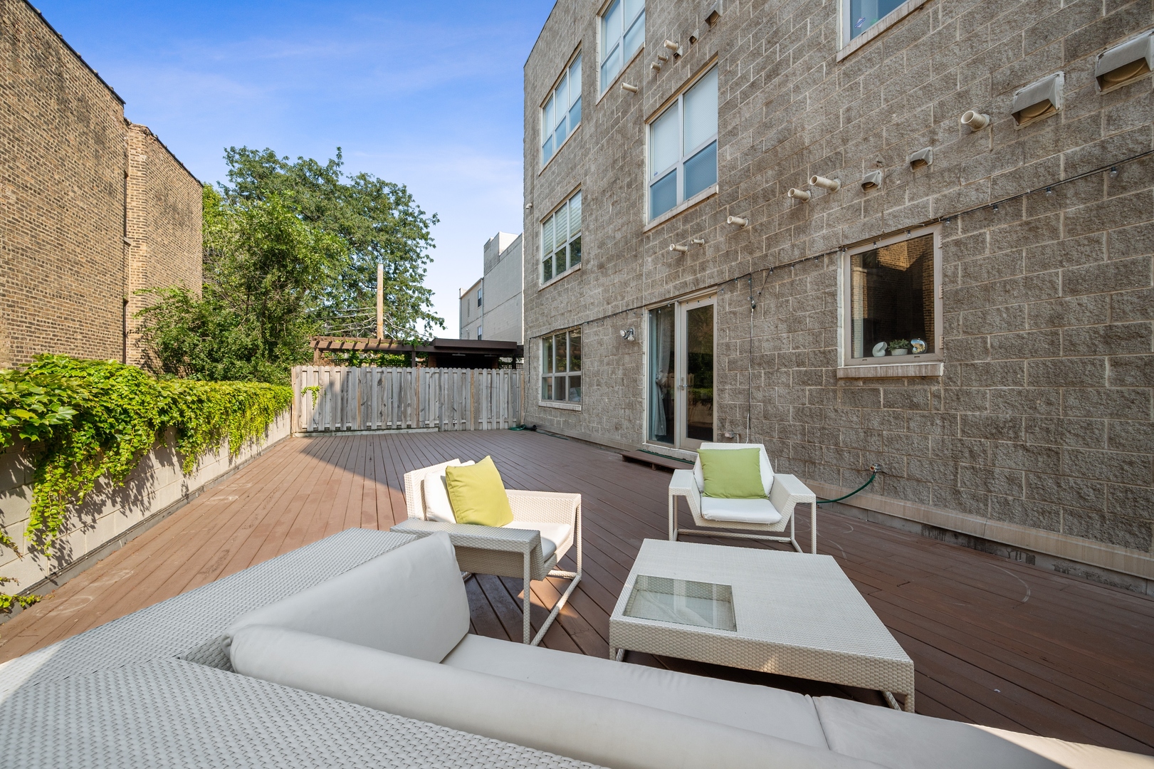 1850 West Division Street, Unit 2E Chicago, IL 60622 - Photo 20 of 22 a view of a patio with couches table and chairs and potted plants