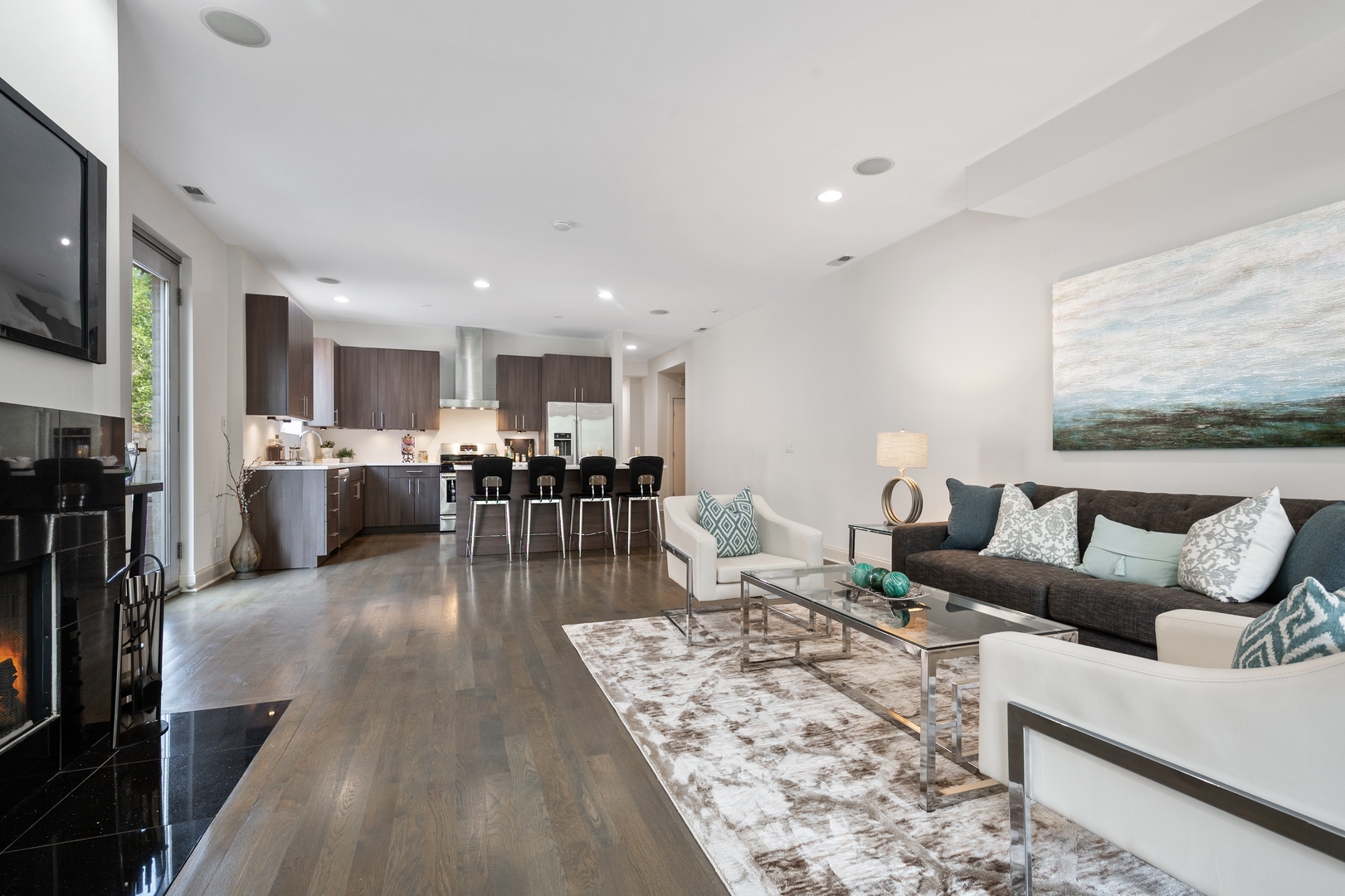1850 West Division Street, Unit 2E Chicago, IL 60622 - Photo 4 of 22 a living room with furniture and a flat screen tv