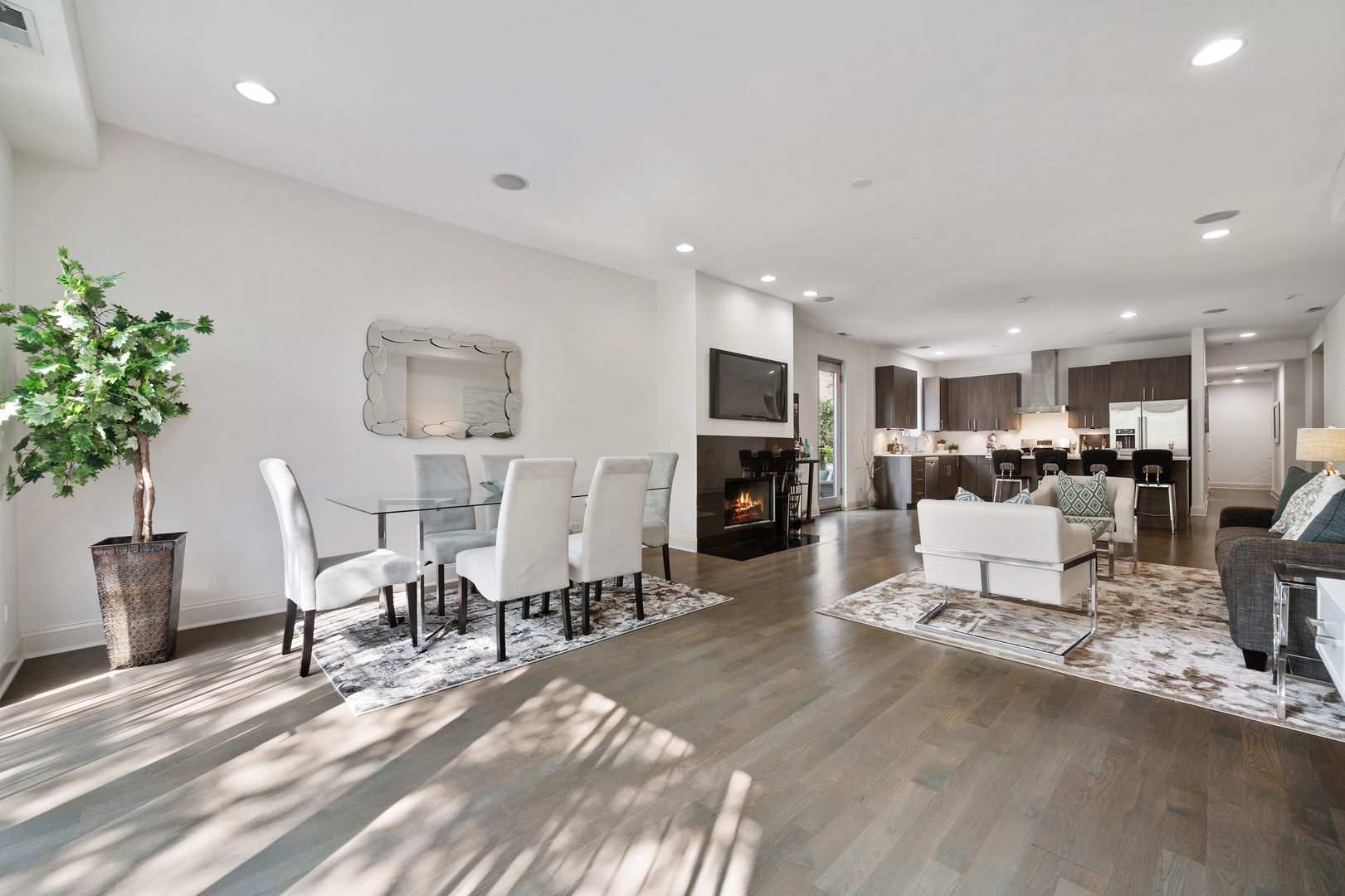 1850 West Division Street, Unit 2E Chicago, IL 60622 - Photo 5 of 22 a living room with furniture and a dining table with kitchen view