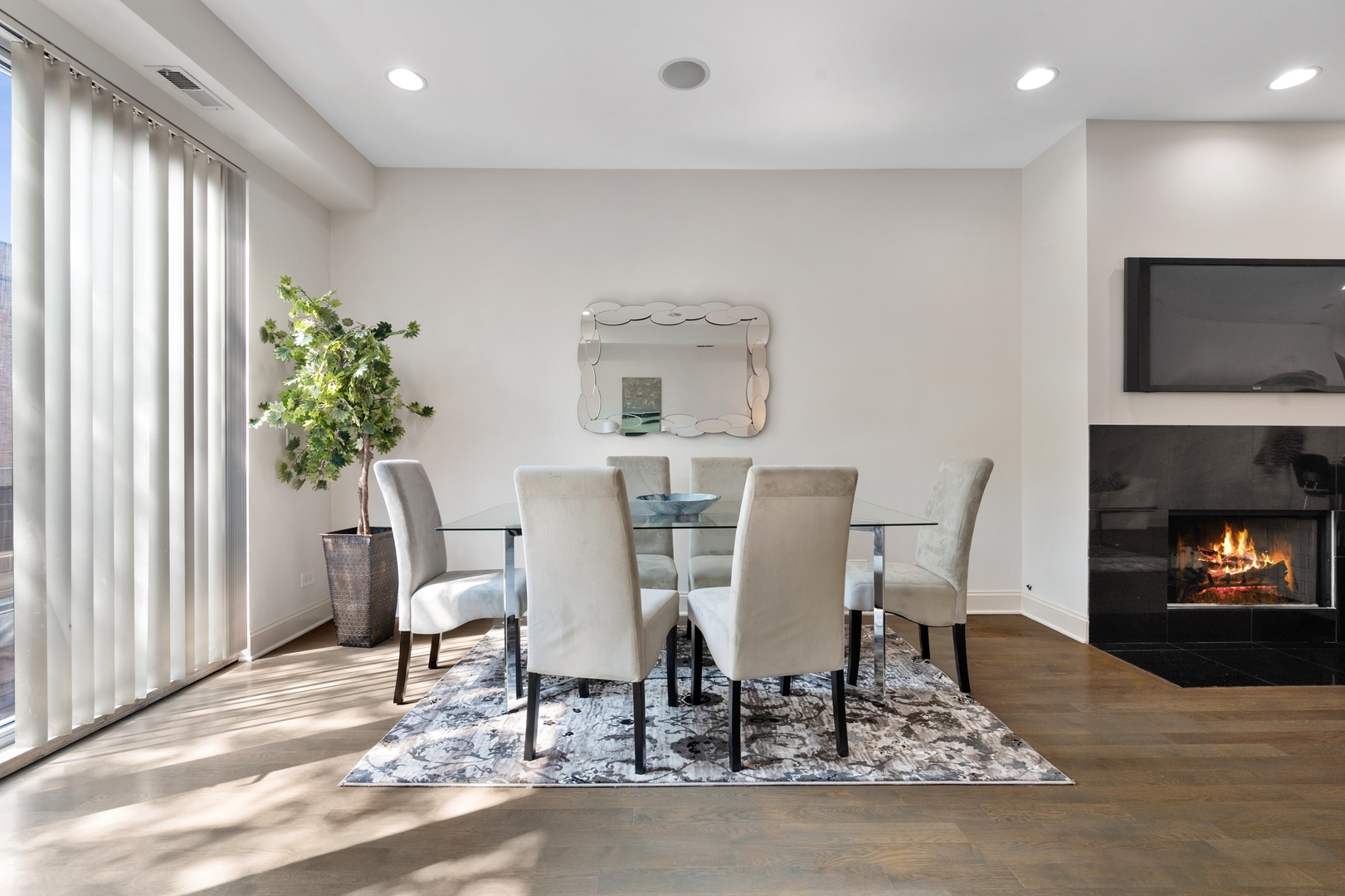1850 West Division Street, Unit 2E Chicago, IL 60622 - Photo 6 of 22 a view of a dining room with furniture and a fireplace