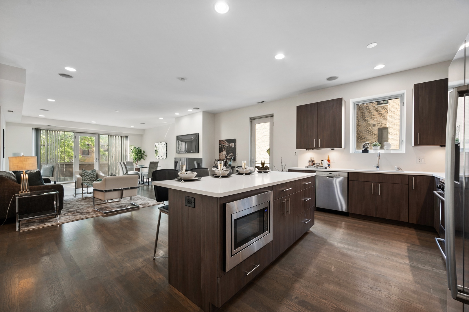 1850 West Division Street, Unit 2E Chicago, IL 60622 - Photo 10 of 22 a kitchen with stainless steel appliances granite countertop a stove and a sink