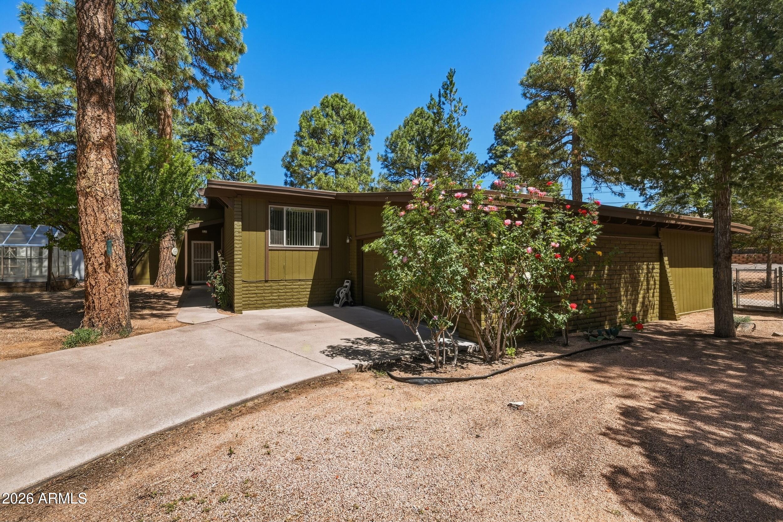 902 South Pineview Street Payson, AZ 85541 - Photo 29 of 32 a view of a house with a yard and garage