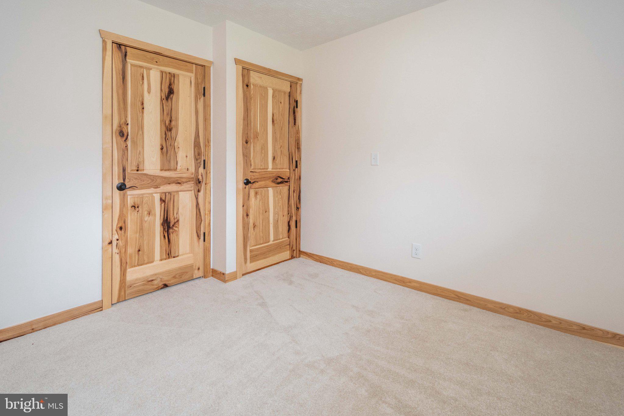 2155 Jennings Road Grantsville, MD 21536 - Photo 32 of 39 Charming bedroom with rustic doors.