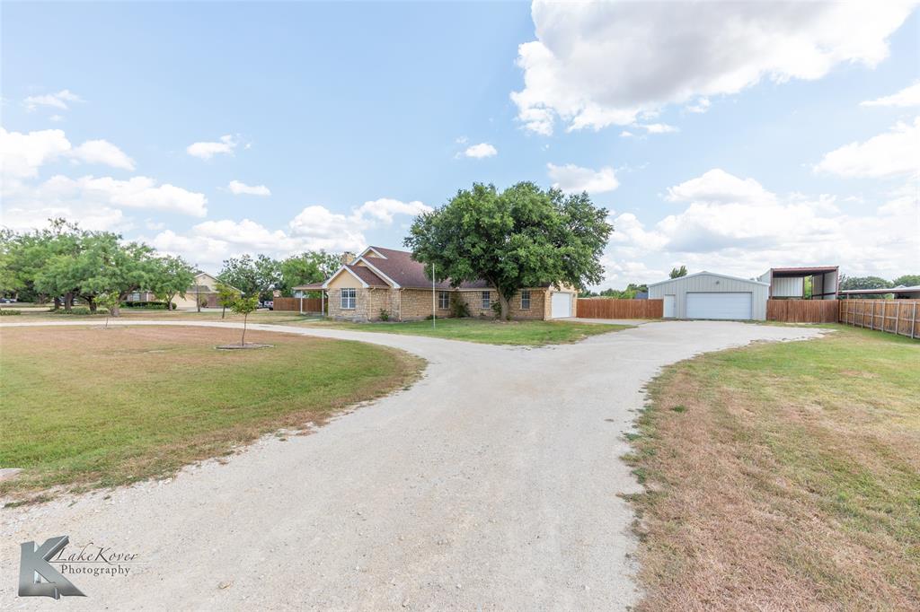 a view of a swimming pool and a yard