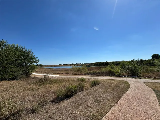 a view of lake with green space