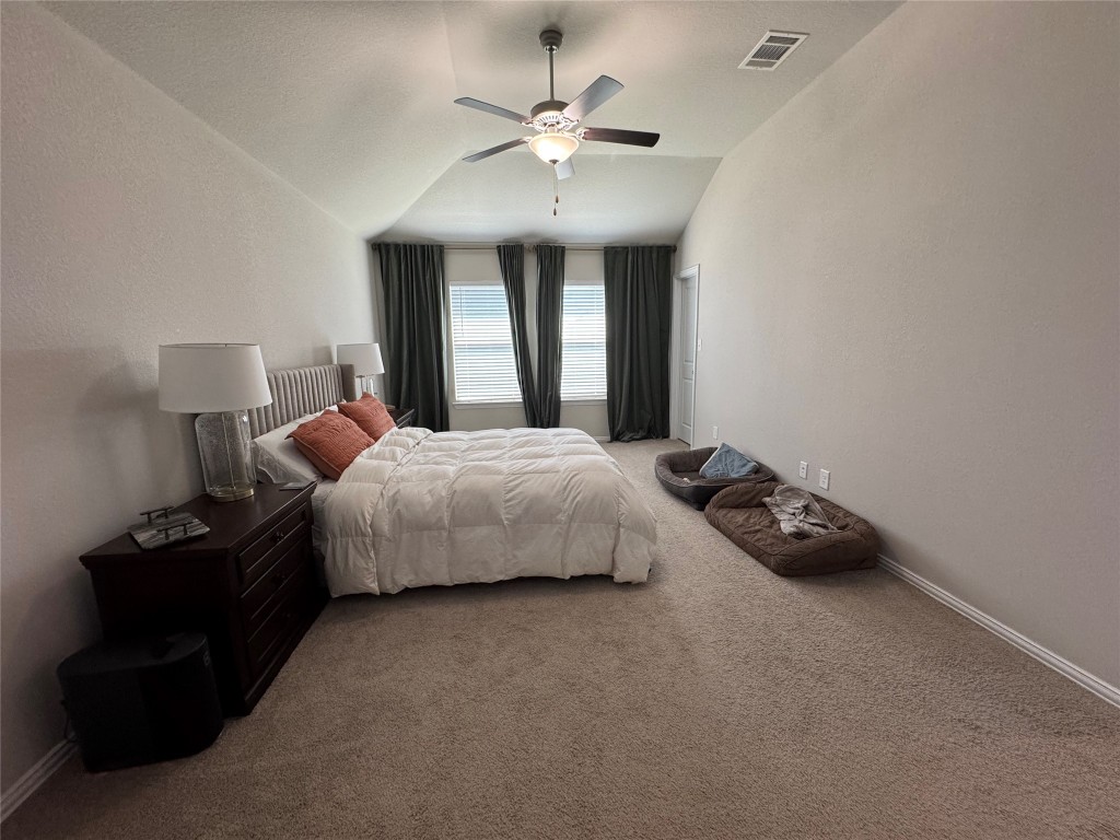 247 Simon Kyle, TX 78640 - Photo 8 of 23 a bedroom with a bed and window