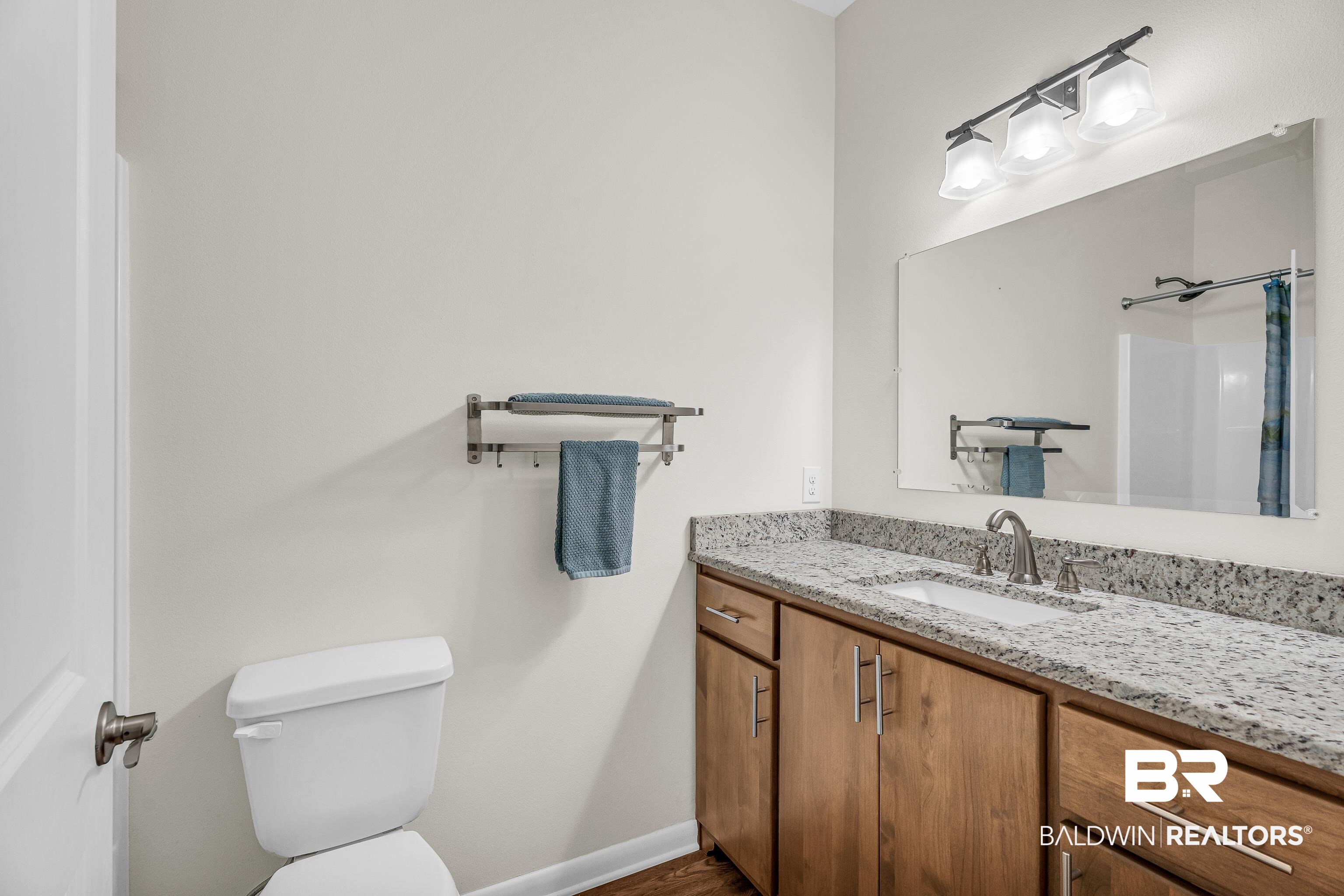 18255 Cactus Court Elberta, AL 36530 - Photo 30 of 53 Bathroom featuring vanity and a shower with curtain