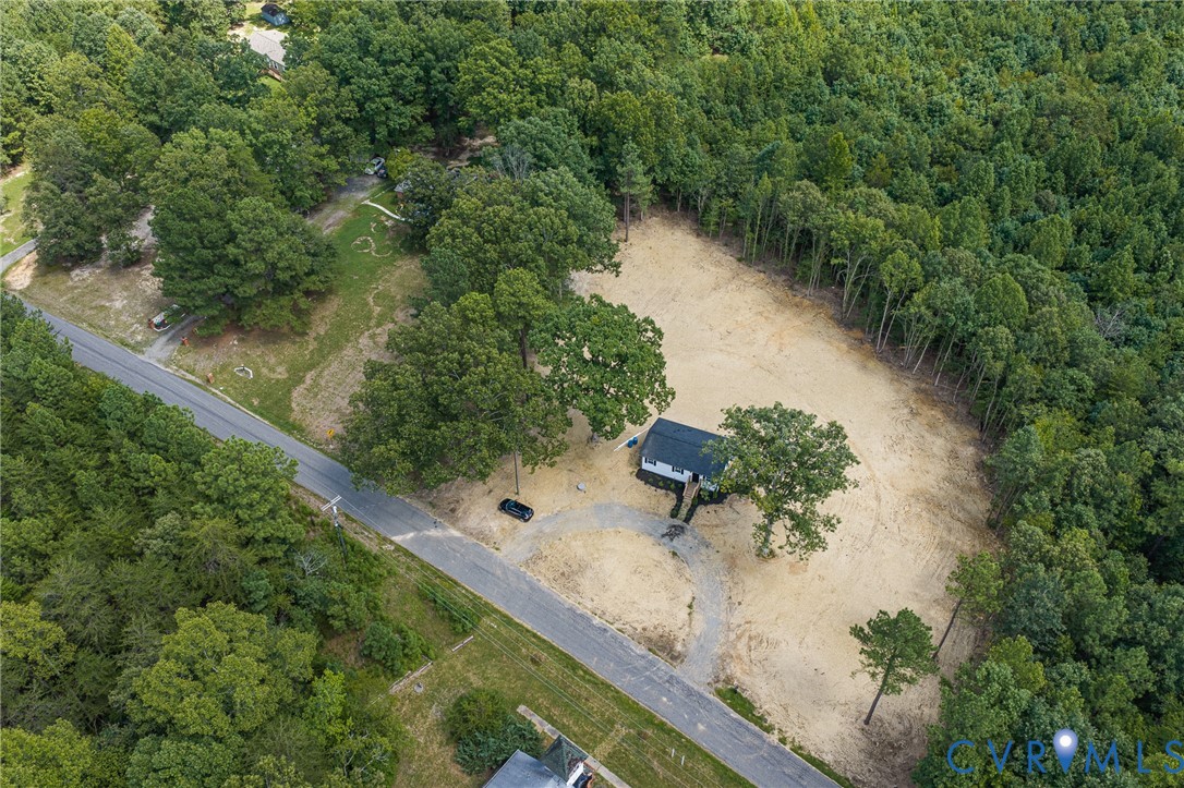 21139 Pendleton Road Bowling Green, VA 22427 - Photo 34 of 41 Single-story residence on a cleared lot, featuring