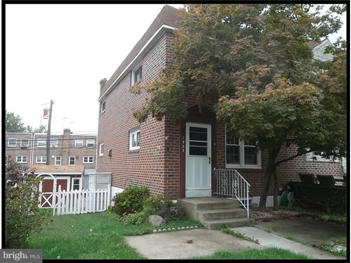 1925 Carter Road Folcroft, PA 19032 - Photo 1 of 25 a front view of a house with a garden